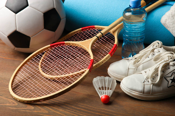 Different sports equipment  on wooden background. Concept sport. - Foto, Bild
