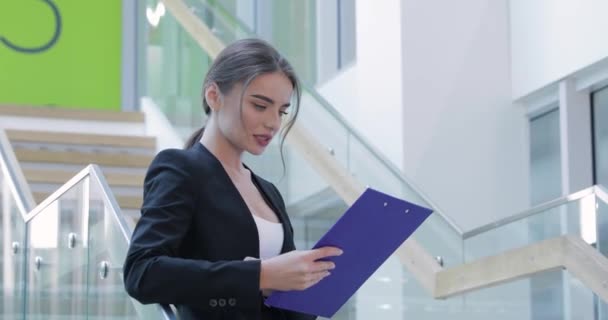 Business Woman With Folder In Hands In Office Building - Felvétel, videó