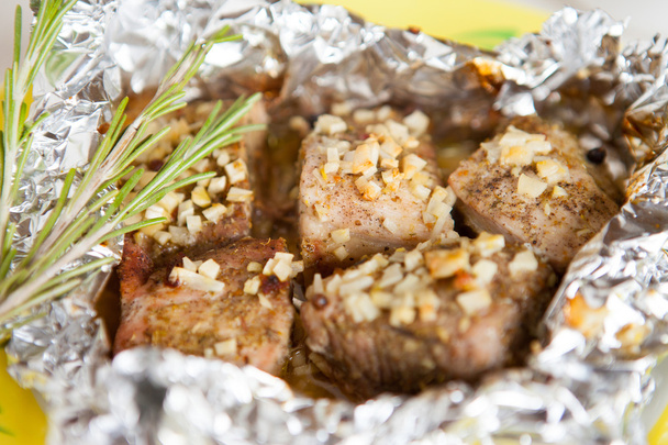 Pieces of meat baked in foil - Photo, Image