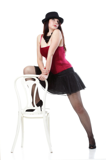 showgirl woman dance in red corset chair white isolated - Foto, Bild