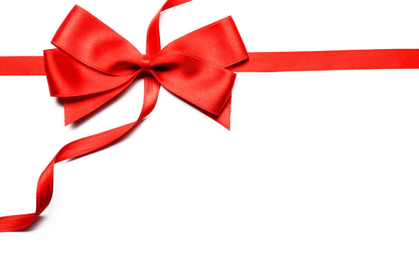 Red ribbons with beautiful bow on white background - Photo, Image