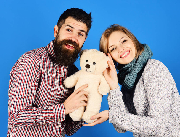 Girl and man with happy faces play with soft toy. - Fotografie, Obrázek