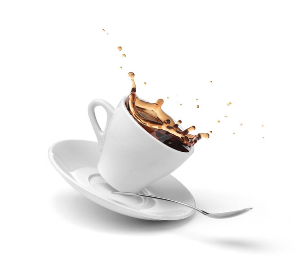 coffee splashing out of a cup isolated on white - Fotó, kép