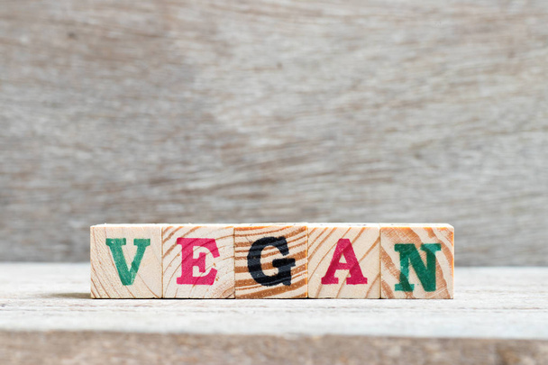Letter block in word vegan on wood background - Valokuva, kuva