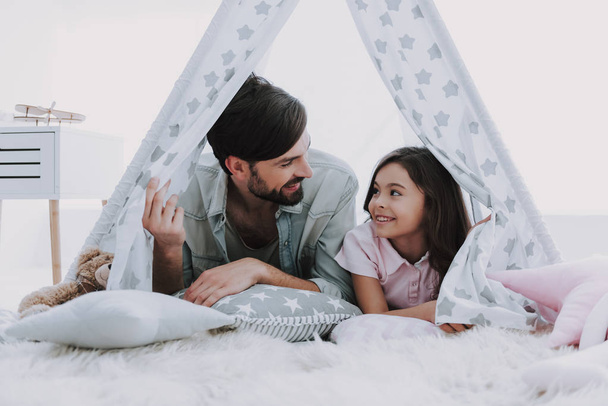 Cute Young Daughter on Playing Hut with Handsome Dad. Happy Father's Day Concept. Father with Daughter Spending Time Togetherness at Home. Happy Family Daughter Laughs on Holiday - Фото, зображення