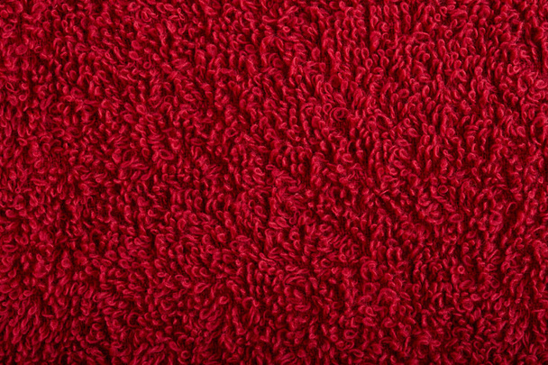 weefsel en textuur concept - close-up van een handdoek badstof of badstof textiel achtergrond - Foto, afbeelding
