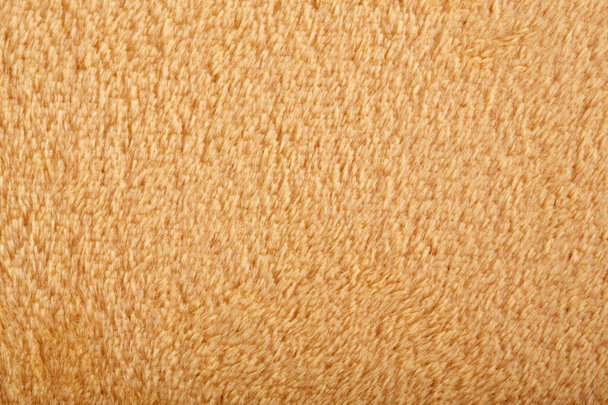 Textur aus braunem flauschigen weichen Plüsch. Handtuch Frottee, weiche Textur Tuch - Foto, Bild