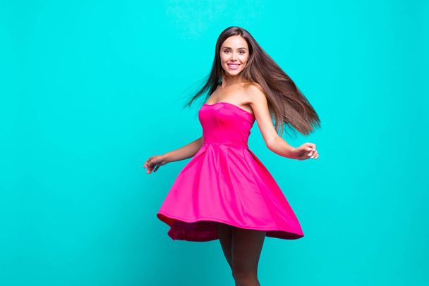 Young straight-haired sweet brunette smiling girl wearing pink d - Foto, afbeelding