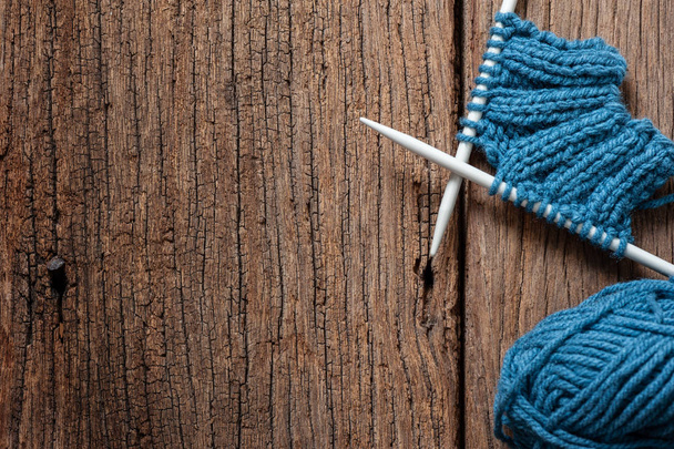 Blue knitting wool and knitting needles, knitting equipment - Фото, изображение