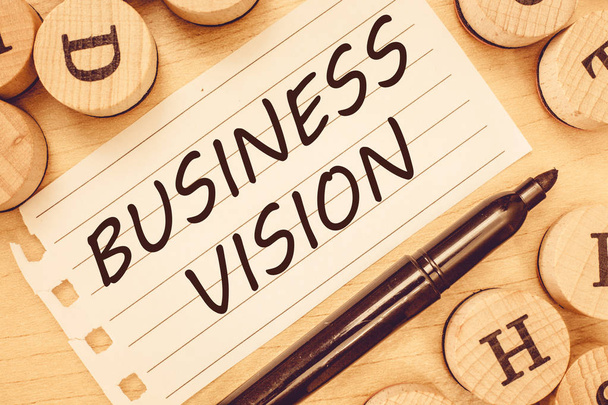 Woord schrijven tekst Business Vision. Business concept voor groei van uw bedrijf in de toekomst op basis van uw doelstellingen - Foto, afbeelding
