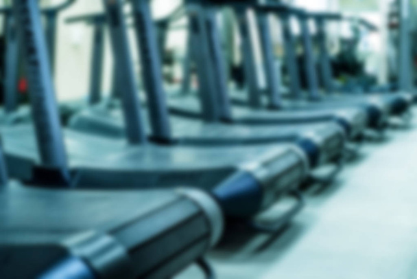 Blurred empty treadmills set in gym interior close - Photo, Image