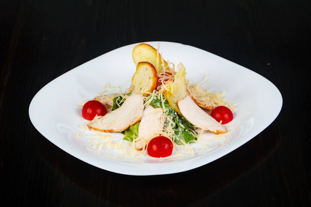 Traditional Caesar salad with chicken - Фото, изображение