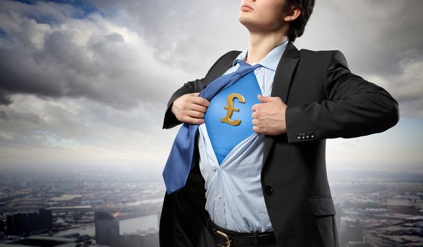 Businessman showing superman suit underneath shirt - Photo, Image