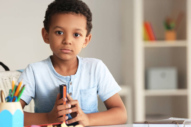 Cute African-American boy in classroom - Photo, Image