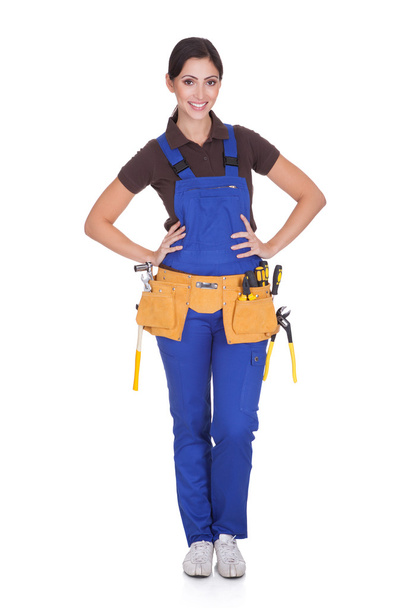 Female Construction Worker With Toolbelt - Foto, imagen