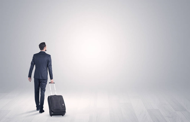 Business with luggage in a boundless space - Photo, Image