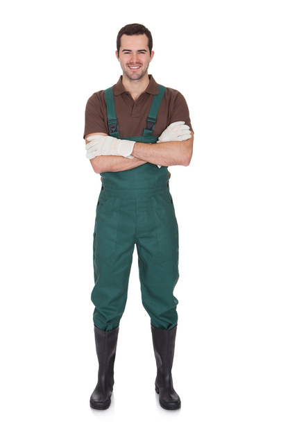 Happy young gardener in dungarees - Photo, Image