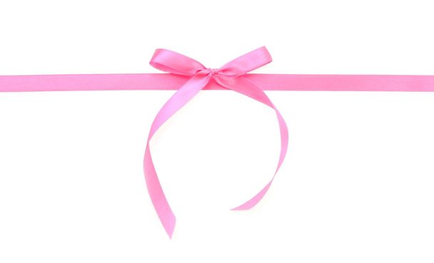 Pink ribbon with bow on white background - Photo, Image