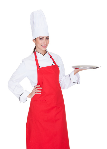 Female Chef Presenting Plate - 写真・画像