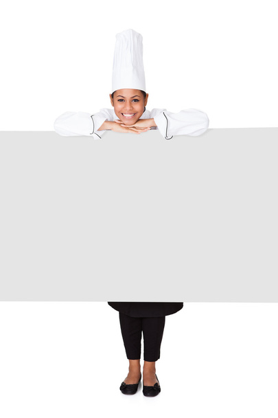 Female Cook Standing Behind The Placard - Φωτογραφία, εικόνα