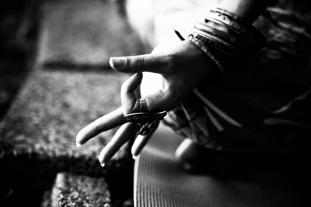 closeup of woman hand in mudra gesture practice yoga outdoor bw - Photo, Image