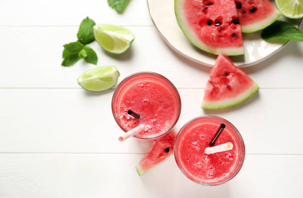 Glasses with fresh watermelon smoothie on white table - Foto, imagen