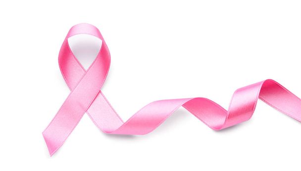 白い背景にピンクのリボン。乳がんの概念 - 写真・画像