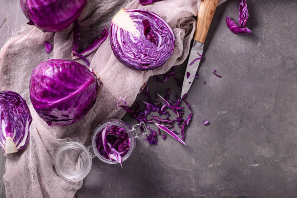 Ripe red cabbages on grey table - 写真・画像
