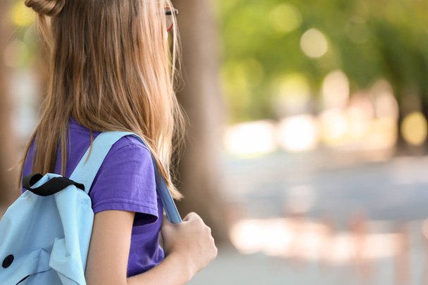 Cute schoolgirl with backpack outdoors - Zdjęcie, obraz