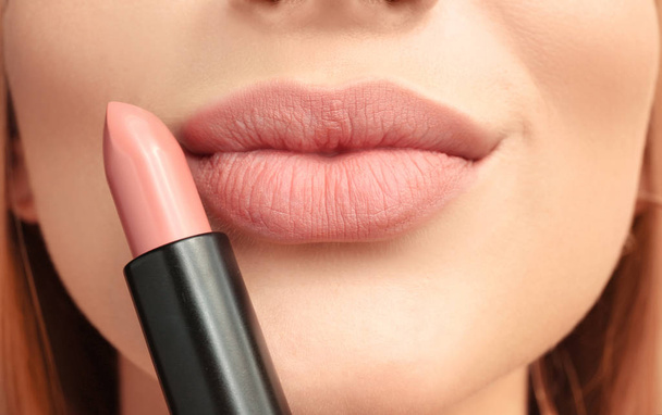 Beautiful young woman with pink lipstick, closeup - Фото, изображение