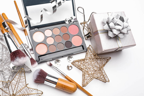 Set of cosmetics with Christmas present and decorations on white background - Foto, Bild