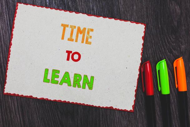 Text sign showing Time To Learn. Conceptual photo Obtain new knowledge or skill Educational or career growth White paper red borders colorful markers wooden background expressing ideas. - Photo, Image