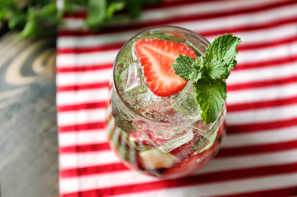 Glass of fresh strawberry mojito on table, closeup - Photo, Image