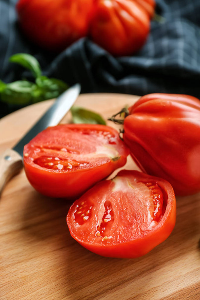 Delicious sliced tomatoes on wooden board, closeup - Photo, image