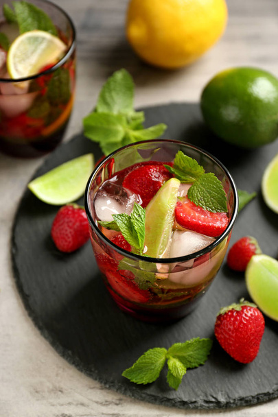 Glass of fresh strawberry lemonade on slate plate - Foto, immagini