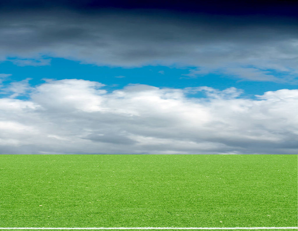 football field blue sky with clouds - Photo, Image