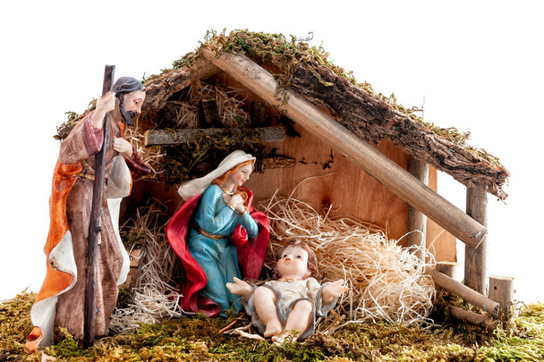 Joulusyntymä. Mökki Jeesus-lapsi seimessä, Maria ja Joosef. Eristetty valkoisella pohjalla
. - Valokuva, kuva