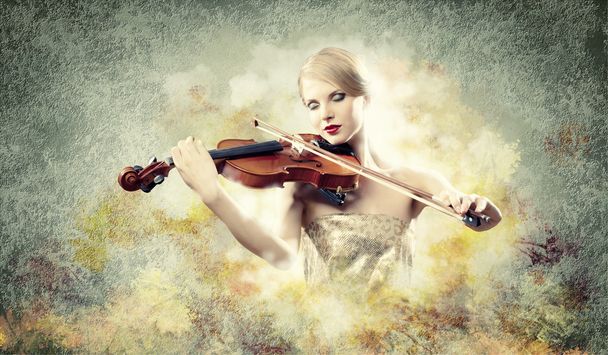 Gorgeous woman playing on violin - Photo, Image