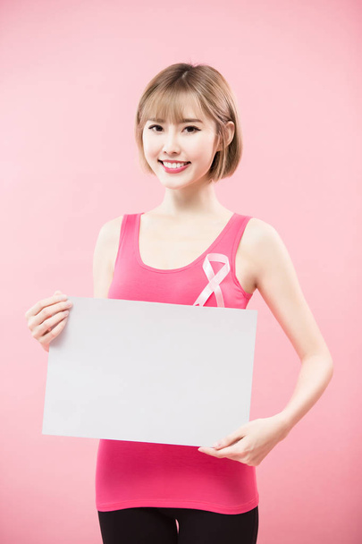 woman with white billboard. prevention breast cancer concept - Photo, image