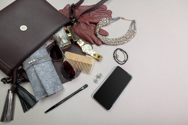 View on female bag accessories on pastel background - Fotoğraf, Görsel