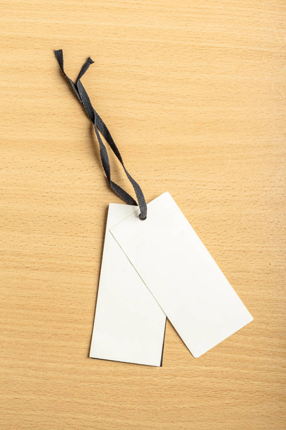 Blank paper tags on wooden background - Photo, Image