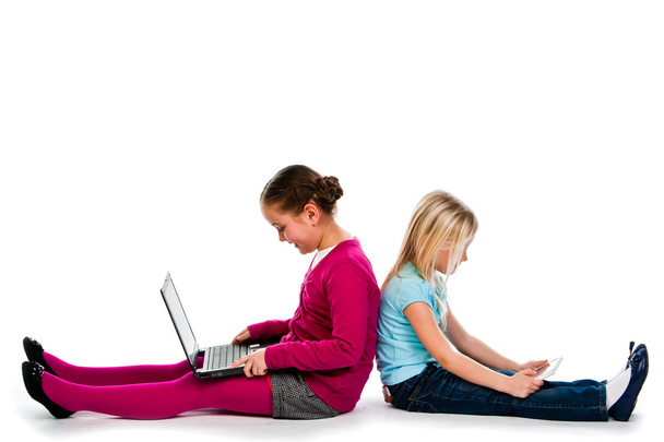 Two girls with laptops - Фото, изображение