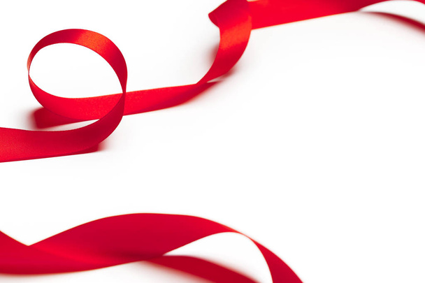 Red ribbon on white background - 写真・画像