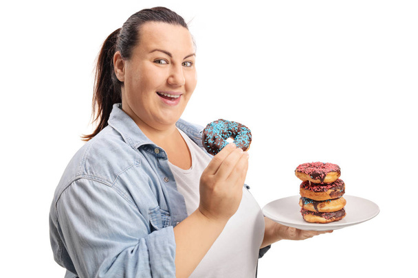 Overweight woman eating donuts isolated on white background - Foto, Imagem