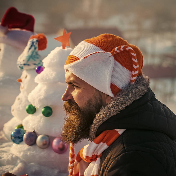 Man in hat and scarf on winter day - Фото, зображення