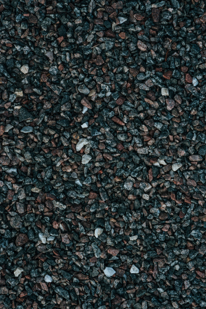 Vollbild-Aufnahme von kleinen Kieselsteinen auf dem Boden als Hintergrund - Foto, Bild