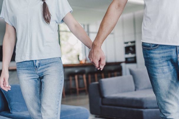 cropped image of couple holding hands at home - Photo, Image