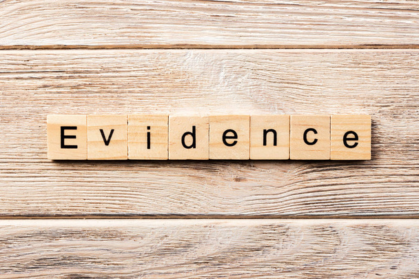 evidence word written on wood block. evidence text on table, concept. - Φωτογραφία, εικόνα