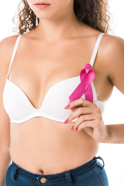 cropped shot of young woman in bra holding pink ribbon, breast cancer awareness concept   - Photo, Image