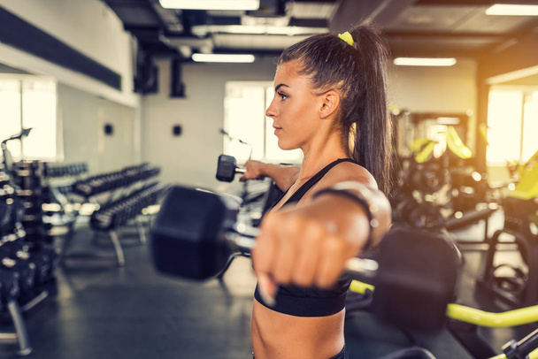 Young woman workout in gym healthy lifestyle - Foto, Imagem